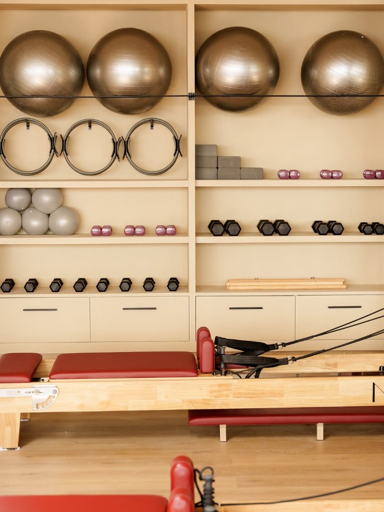 Organized props and reformer in the studio